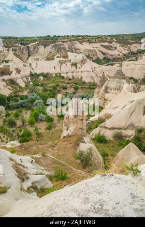 Looking across a valley of fairy chimney rock formations in Goreme, Cappadocia, Turkey Stock Photo