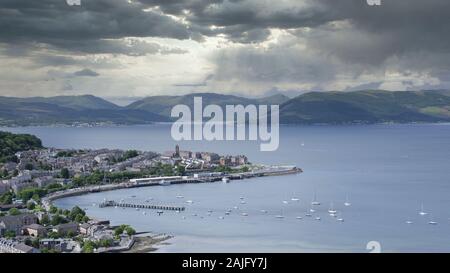 View of Gourock coastal seaside town from Lyle Hill in Greenock during the storm light and dark clouds over mountain  range Scotland UK Stock Photo