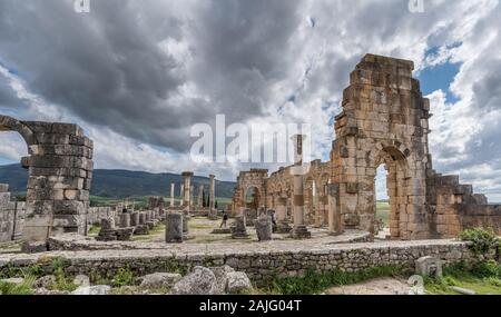 Volubilis, Morocco: Excavation and archaeological site, ruins of the Roman basilica, Berber city and UNESCO World Heritage Site near Meknes Stock Photo
