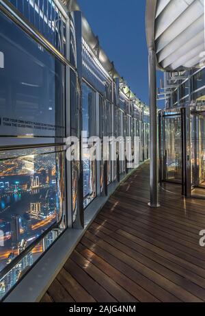 Dubai, United Arab Emirates: At the Top Burj Khalifa (floor 148) highest terrace observation deck with aerial view over Dubai, nobody, by night Stock Photo