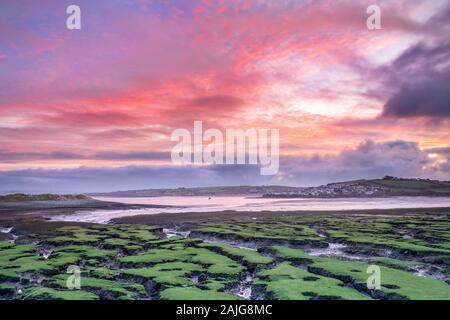 Appledore, North Devon, England. Saturday 4th January 2020. UK Weather. After a cold but dry night in North Devon, at sunrise the cloud breaks and the dawn sky turns pink over the picturesque coastal village of Appledore. Credit: Terry Mathews/Alamy Live News Stock Photo