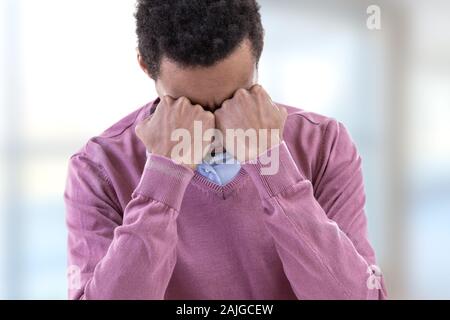 Young man suffering depression feeling sorrow and pain in human emotions facial expressions. Stock Photo