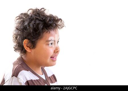 Concept of a happy childhood, smiling boy teenager close-up profile view Stock Photo