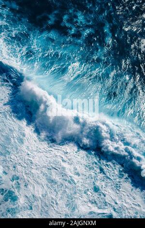 An aerial view of stormy waves splashing against a seashore Stock Photo ...