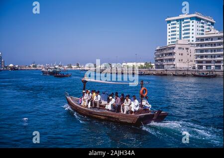 Dubai Creek waterway life and soul of this famous city and worldwide tourist destination with Abbra water taxis going to and fro across the creek from Dubai to Deira side Stock Photo