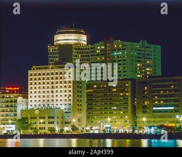 Nighttime on Dubai Creek waterway life and soul of this famous city and worldwide tourist destination looking towards Deira side Stock Photo