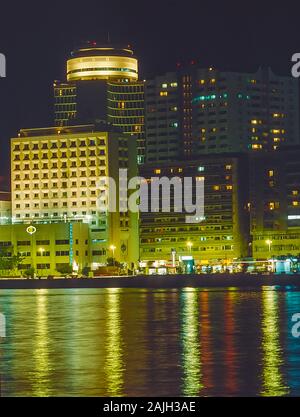 Nighttime on Dubai Creek waterway life and soul of this famous city and worldwide tourist destination looking towards Deira side Stock Photo