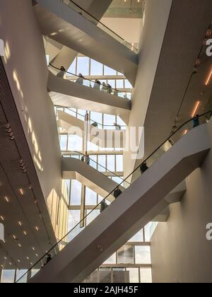 GRONINGEN, NETHERLANDS - DECEMBER 1, 2019: Inside a new building called 'Groninger Forum' in the city centre of Groningen. Lot of escalators viewed fr Stock Photo