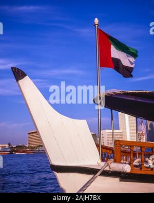 Dubai Creek waterway life and soul of this famous city and worldwide tourist destination with the UAE National Flag Stock Photo