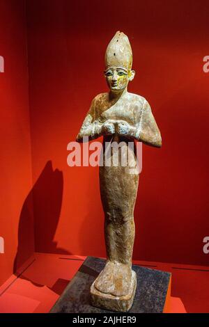 Photo taken during the opening visit of the exhibition “Osiris, Egypt's Sunken Mysteries”. Statue of Osiris, sycamore wood and gold. Stock Photo