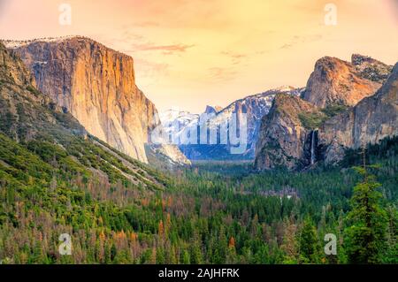 Yosemite National Park overlook at sunset. Panorama of El Captain, Half Dome and Horsetail Waterfall. California, United States. Stock Photo
