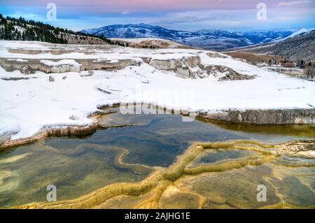 View of Canary Springs and terraces of Mammoth Hot Springs area during winter, Yellowstone National Park, USA. Stock Photo