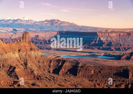 Dead Horse Point State Park overlook at sunset with the typical orange rocks formation. Utah, United States. Stock Photo