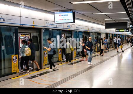 HongKong, China - November, 2019:  People using subway train at  MTR station / metro train station in HongKong Stock Photo