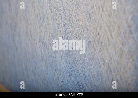 The side of a dusty furnace filter removed from the furnace. Stock Photo