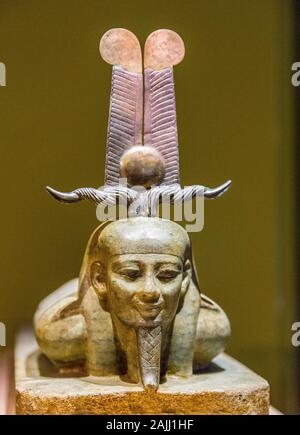 Photo taken during the opening visit of the exhibition “Osiris, Egypt's Sunken Mysteries”. Detail of a statue of the god Osiris awakening. Stock Photo