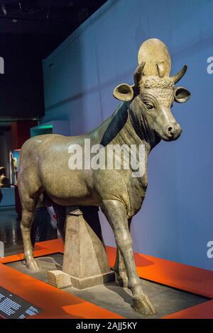 Photo taken during the opening visit of the exhibition “Osiris, Egypt's Sunken Mysteries”. Statue of the Apis bull. Stock Photo