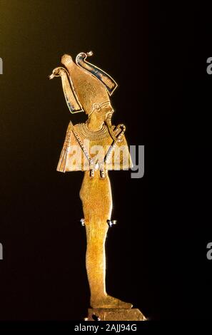 Photo taken during the opening visit of the exhibition “Osiris, Egypt's Sunken Mysteries”. Amulet in gold depicting the god Osiris. Stock Photo