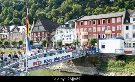 Lovely middle Rhine River village called St. Goat as seen from a KD Cruise boat taking on passengers at one of its stops along the river. Stock Photo