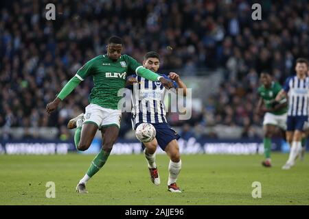 Brighton And Hove, UK. 04th Jan, 2020.   Brighton and Hove, UK. 4th Jan, 2020. Dominic Iorfa of Sheffield Wednesday and Neal Maupay of Brighton & Hove Albion during the The FA Cup 3rd Round match between Brighton and Hove Albion and Sheffield Wednesday at the American Express Community Stadium, Brighton and Hove, England on 4 January 2020. Photo by Dave Peters. Editorial use only, license required for commercial use. No use in betting, games or a single club/league/player publications. Credit: UK Sports Pics Ltd/Alamy Live News Stock Photo