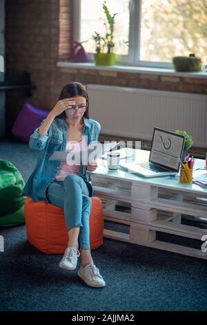 Nice smart businesswoman focusing on her work Stock Photo