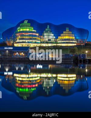 A view of Sage Gateshead reflected in the River Tyne viewed from Newcastle Quayside, Newcastle upon tYne, Tyne & Wear, England, United Kingdom Stock Photo