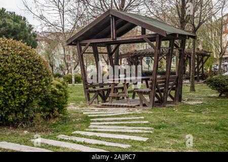 summer wooden gazebo for rest and picnic in one of the parks of Istanbul Stock Photo