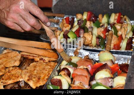 Grilled bacon and vegetables outdoors in the garden Stock Photo
