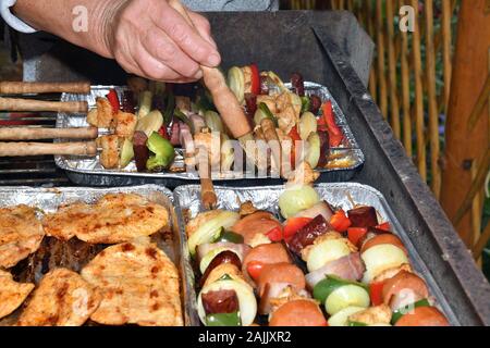 Grilled bacon and vegetables outdoors in the garden Stock Photo