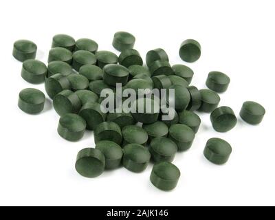 Spirulina Pills on white Background Stock Photo