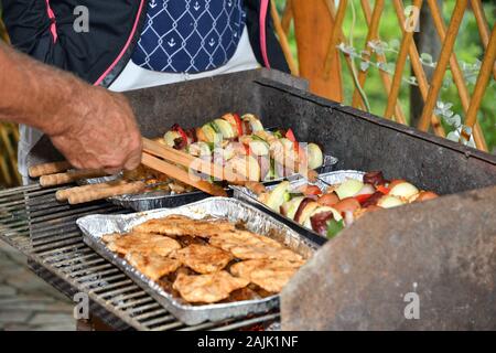Grilled bacon and vegetables outdoors in the garden Stock Photo