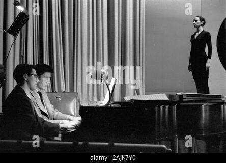 John Cage and David Tudor in performance in New York City, 1957, probably performing Winter Music. The exact date and venue are unknown.