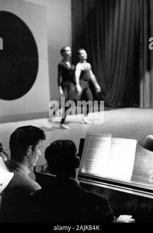 John Cage and David Tudor in performance in New York City, 1957, probably performing Winter Music. The exact date and venue are unknown.