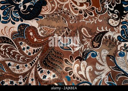 Indian brown paisley patterns on cloth Stock Photo