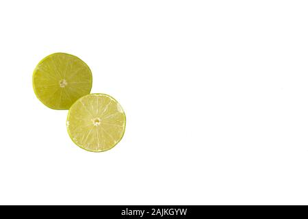 Two lime halves isolated on a white background with copy space to the right Stock Photo