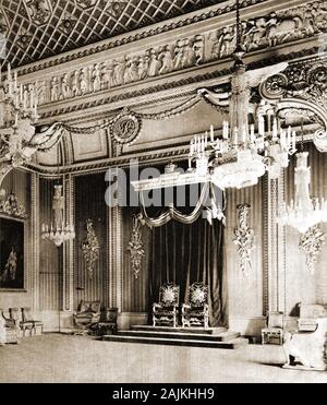 1920. The  royal throne room at Buckingham Palace, London, UK,  after being made ready for debutantes  (young upper class women) to be presented the King & Queen. The last debutantes were presented in this way in  1958, after which Queen Elizabeth II abolished the ceremony. Queen Charlotte's Ball, a contemporary revival of the tradition is still organised annually by the Duke of Somerset. Stock Photo