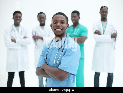 young medic standing in front of his friends colleagues Stock Photo
