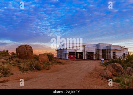 Sunset time at a new home construction site in North Scottsdale, Arizona. Stock Photo