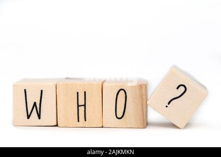 Wooden cubes with the word Who and a question mark isolated on white background Stock Photo