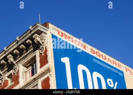 Upper corner of a hotel building against clear blue sky in Tenderloin district of San Francisco, United States of America Stock Photo