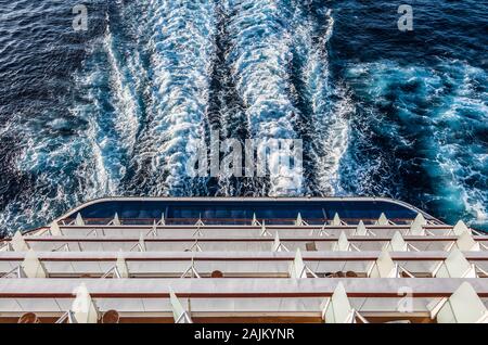 Aerial view of balcony staterooms on the aft of a sailing cruise ship. Stock Photo