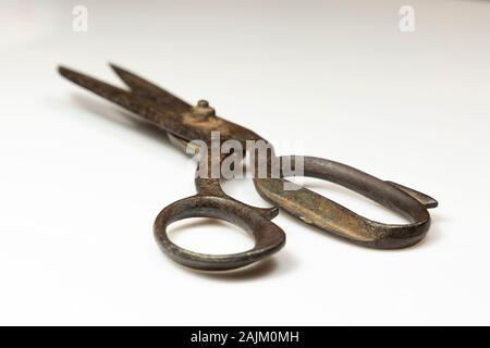 Old-fashioned rusty scissors on white background Stock Photo