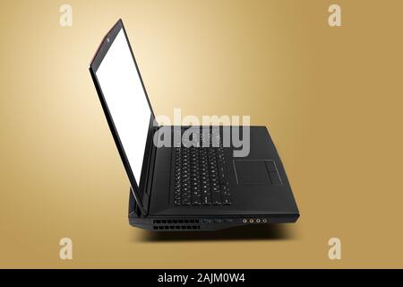 Side view of gaming laptop on golden yellow background. Laptop designed for gamers or professional players or 3d rendering Stock Photo