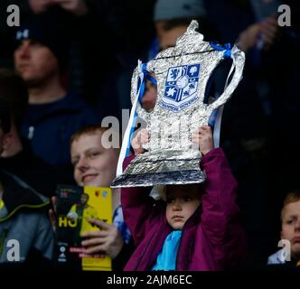 WATFORD, ENGLAND - JANUARY 04:   Tranmere Rovers Fan holding FA Cup during Emirates FA Cup Third Round match between Watford and Tranmere Rovers on Ja