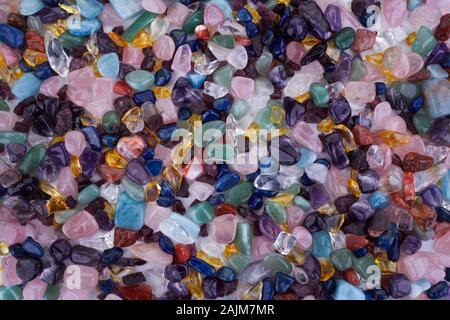 Healing Chakra Crystals Banner - Chakra colored tumbled healing stones. Crystal healing background Stock Photo