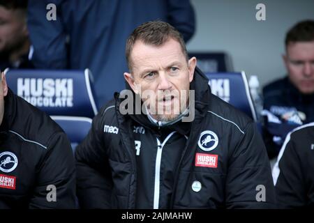 London, UK. 04th Jan, 2020. Millwall Manager Gary Rowett sits in the dugout during The Emirates FA Cup 3rd round match, Millwall v Newport County at the Den in London on Sunday 4th January 2020. this image may only be used for Editorial purposes. Editorial use only, license required for commercial use. No use in betting, games or a single club/league/player publications. pic by Tom Smeeth/Andrew Orchard sports photography/Alamy Live news Credit: Andrew Orchard sports photography/Alamy Live News Stock Photo