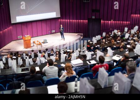 Speaker giving presentation on business conference event. Stock Photo