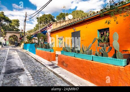 Vibrant orange house with potted cactus plants in on Carrer del Polvor, El  Terreno, Palma, Mallorca, Spain Stock Photo - Alamy