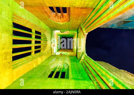 Looking up the tower of Fountains Abbey during christmas floodlit illuminations Stock Photo