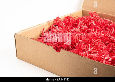 Brown shredded paper, strips of sliced corrugated eco paper for packing  Stock Photo - Alamy